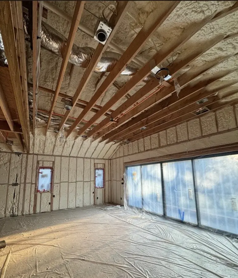 Interior walls and ceiling insulated with spray foam during new construction in El Cerro Mission